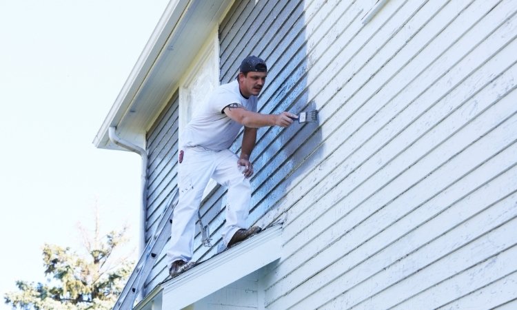 Paint a home exterior